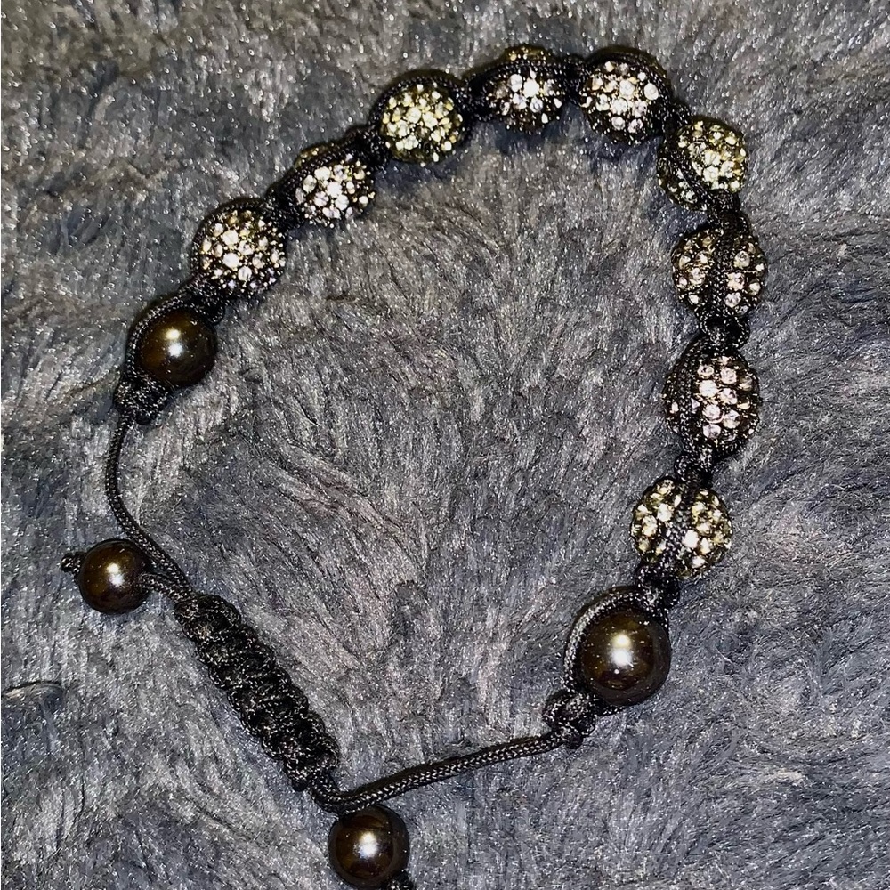 Slip knot Bracelet with Chrystal Balls and heavy steel shiny beads .